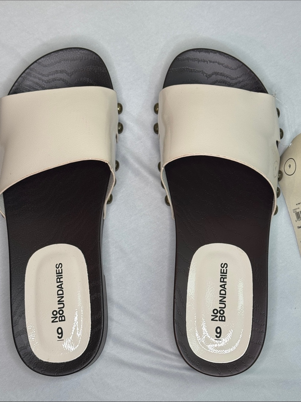No Boundaries Cream and Black Slide Sandals with Stud Accents